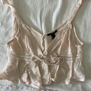 Cropped light pink tank top